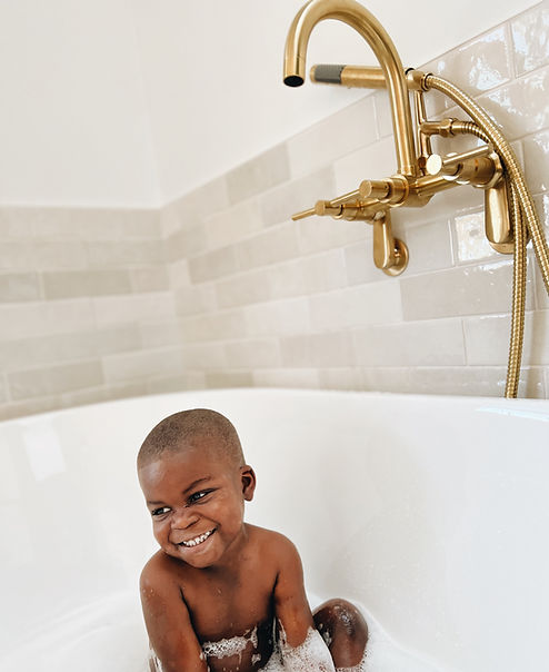Uzi enjoying the first bath in the new tub.